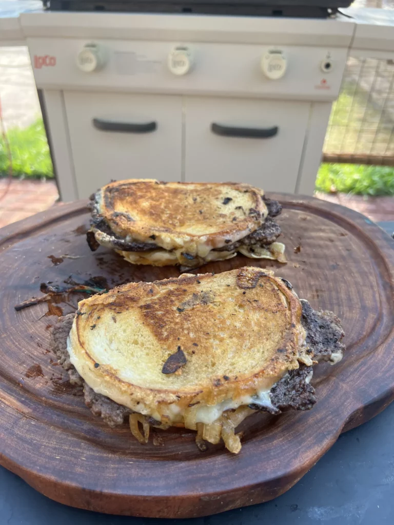 patty melt on a cutting board