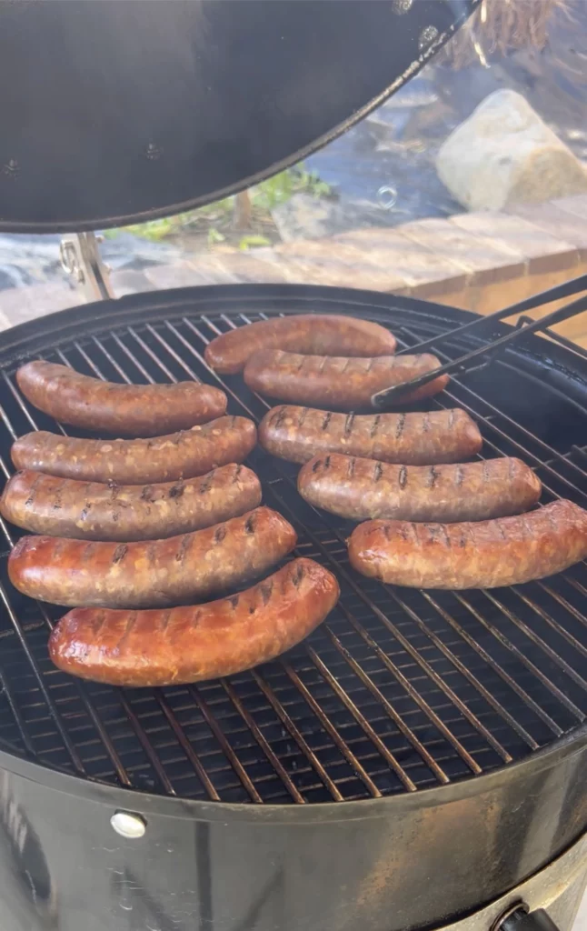 smoking sausages on the grill