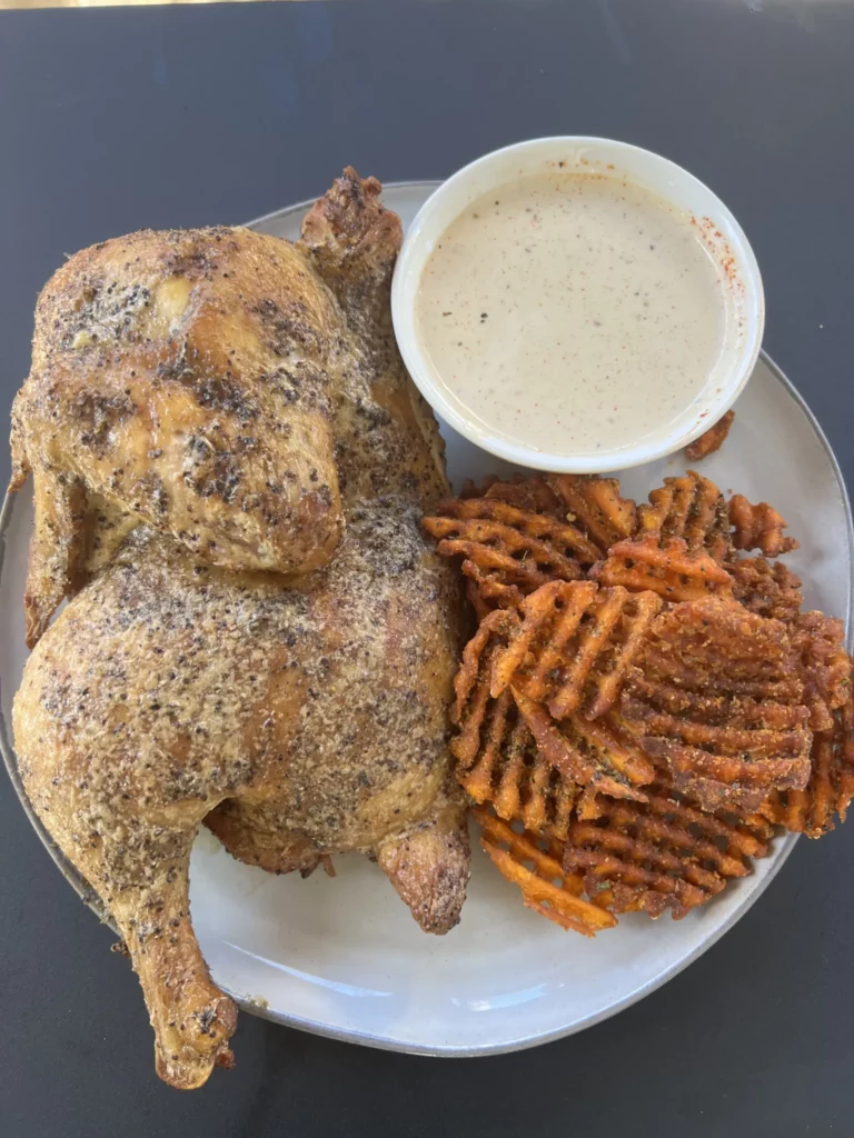 smoked chicken halves and alabama white sauce