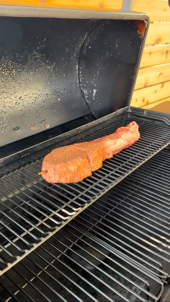 smoking steak on a grill