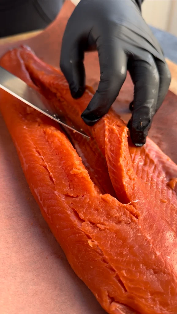 Salmon fillet with a deep pocket cut for stuffing with crab mixture.