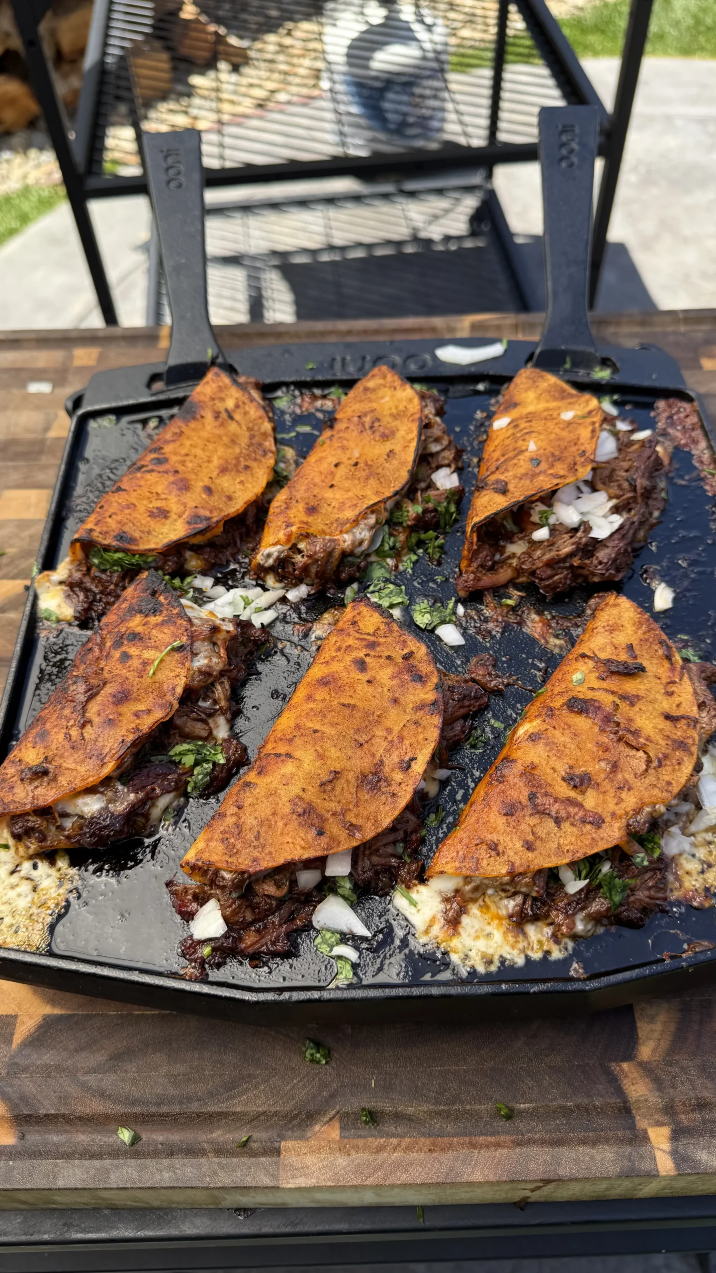 6 birria tacos on a cast iron
