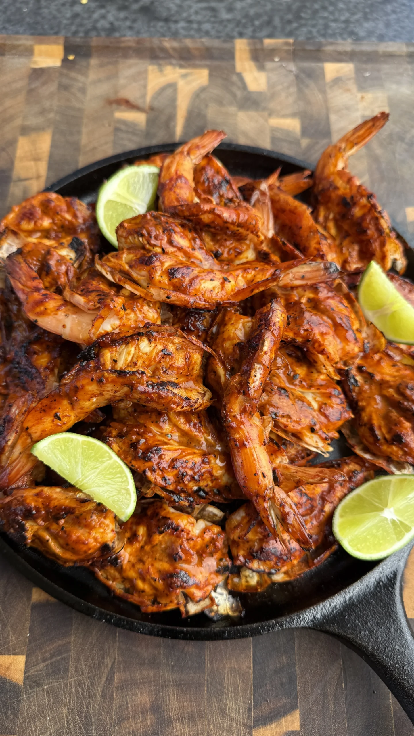 garlic guajillo shrimp on a plate with lime