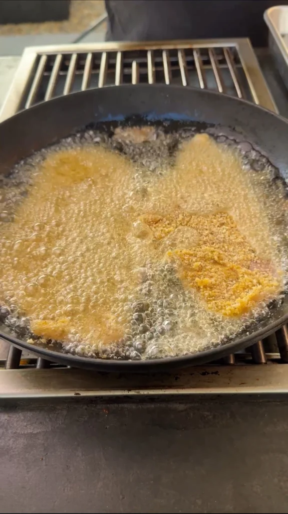 frying chicken in a cast iron skillet