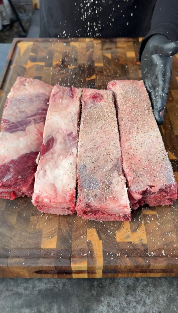 seasoned party ribs on the smoker