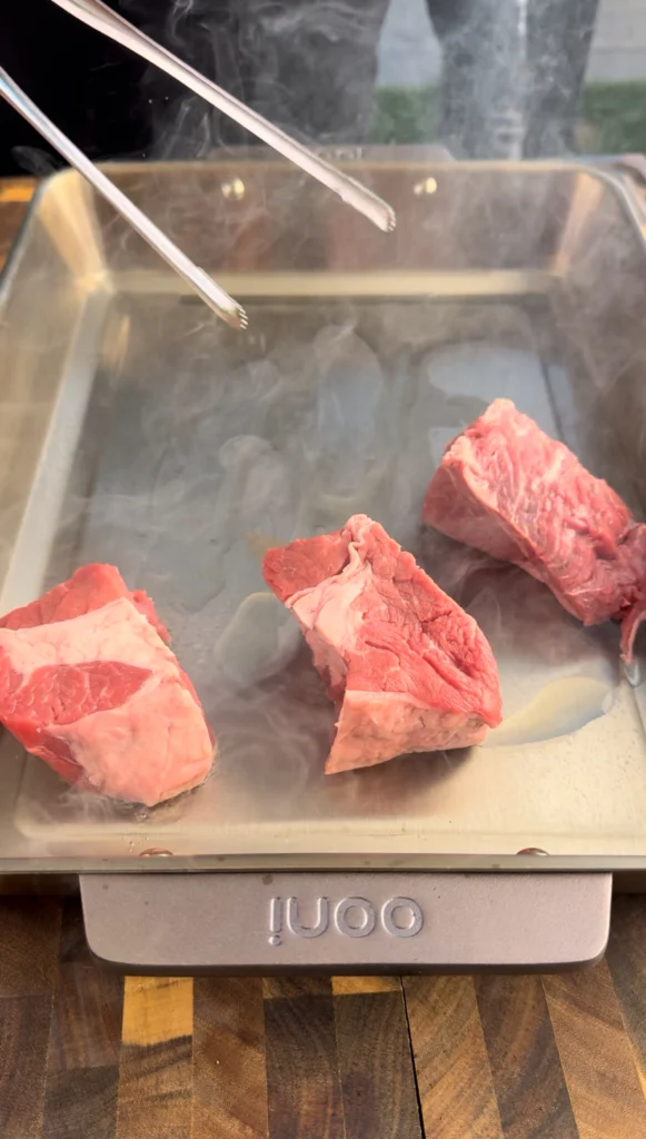 searing the meat on a cast iron