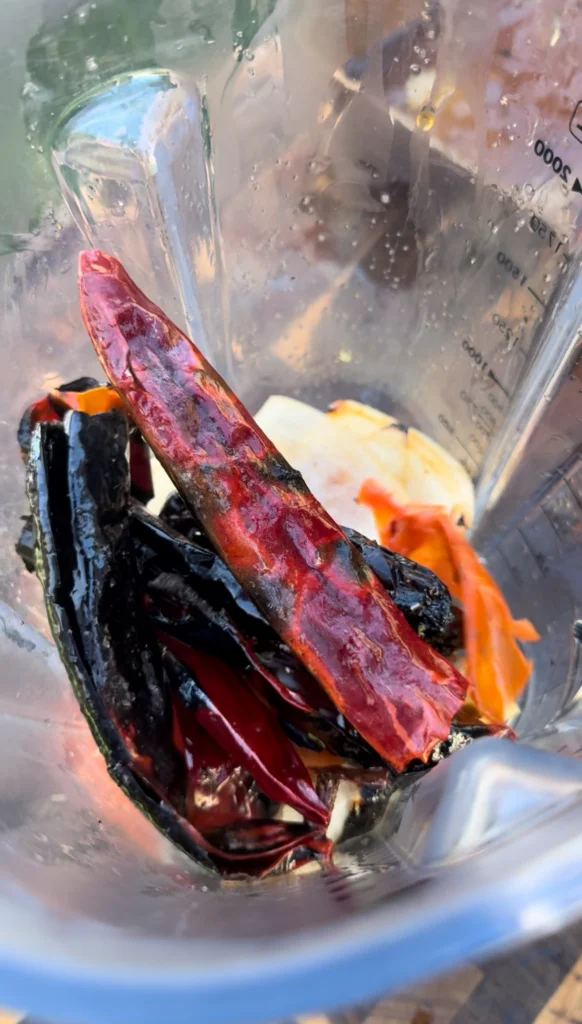 blending the chili base in a blender
