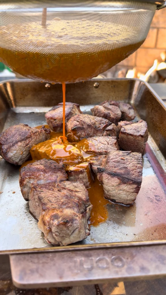 braising the birria tacos