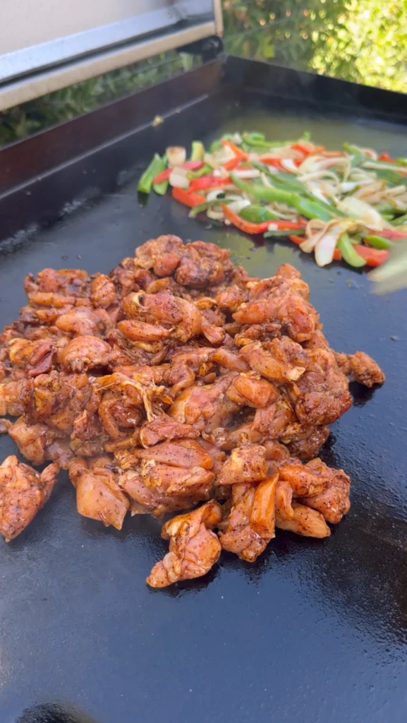 cooking the chicken on a griddle