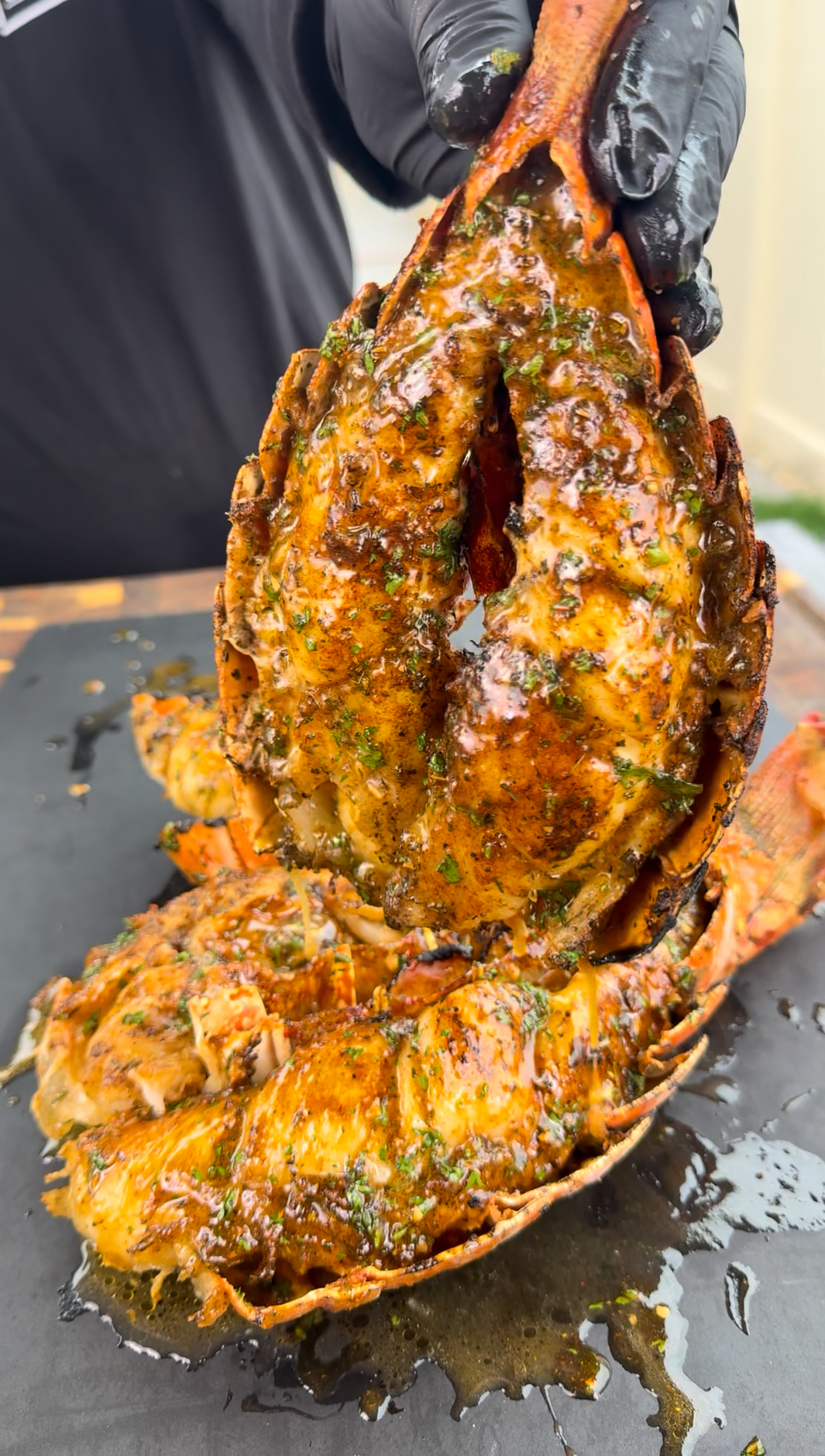 grilled lobster tails on a cutting board