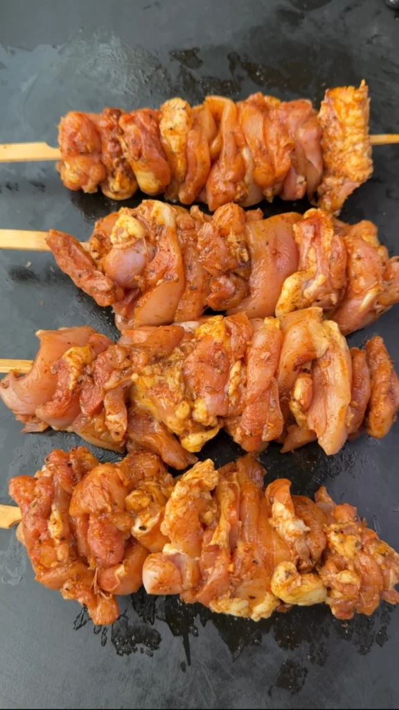 chicken skewers on a cutting board