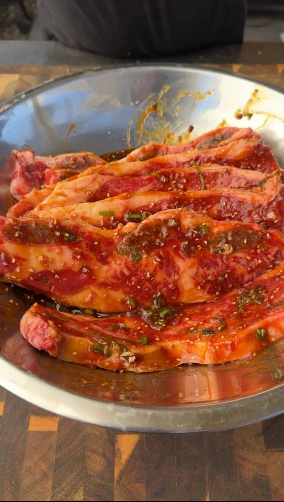 asian marinade in a bowl with the ribs