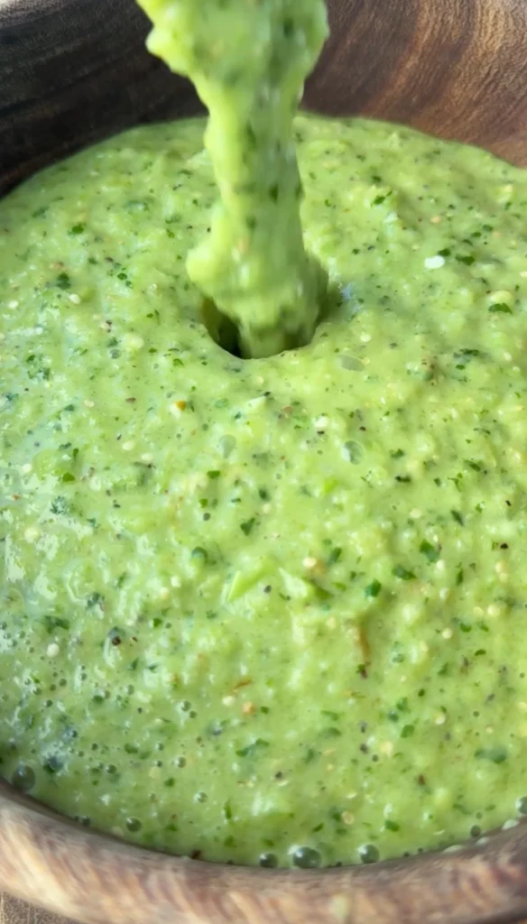 green salsa in a wooden bowl