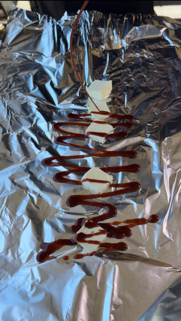 butter and bbq sauce on foil