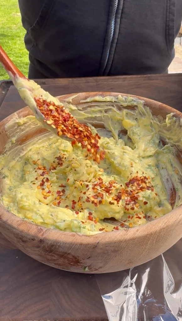 mixing the compound butter in a bowl