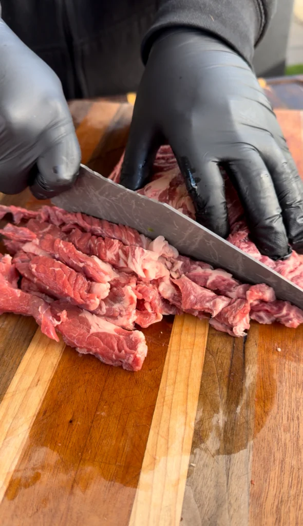 ribeye for the crunchwrap on a cutting board