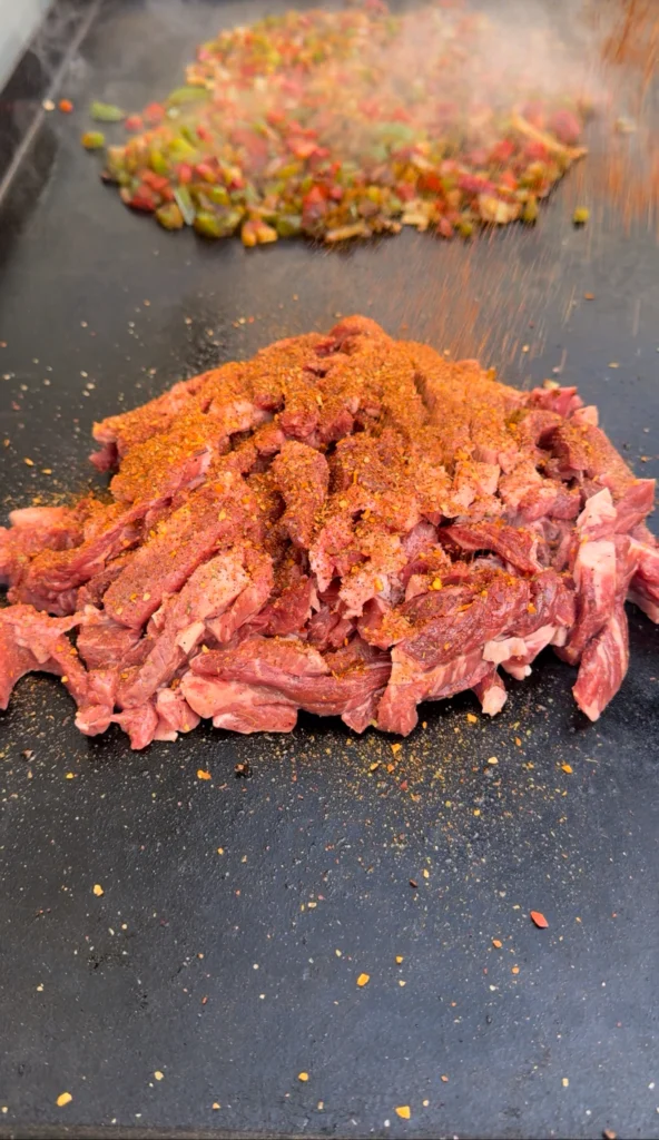 cooked ribeye on the griddle