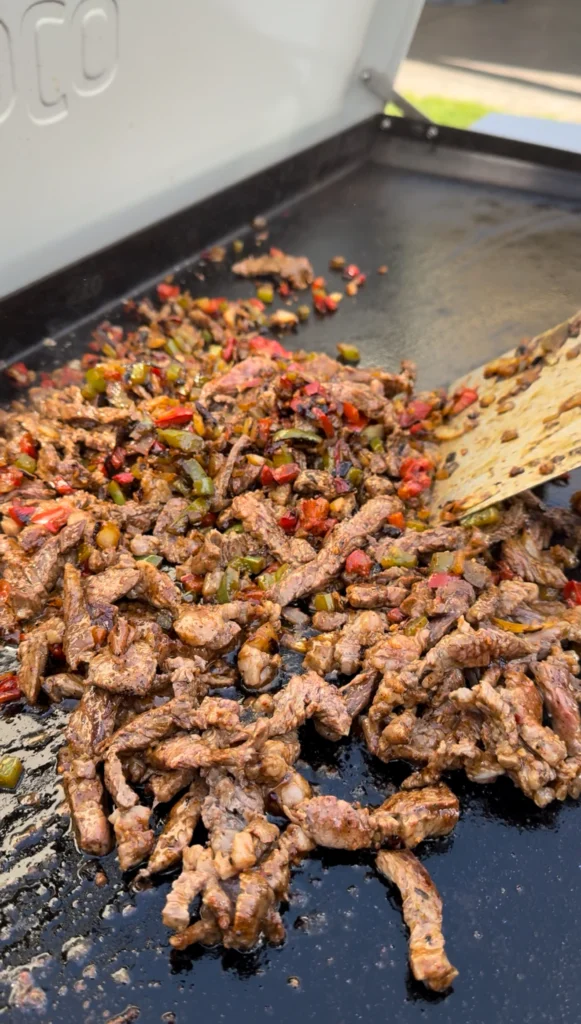 grilled vegetables and steak on the griddle