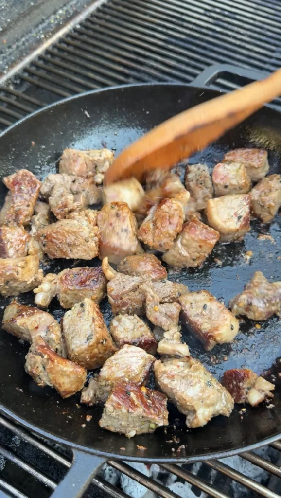 easy steak bites in a cast iron