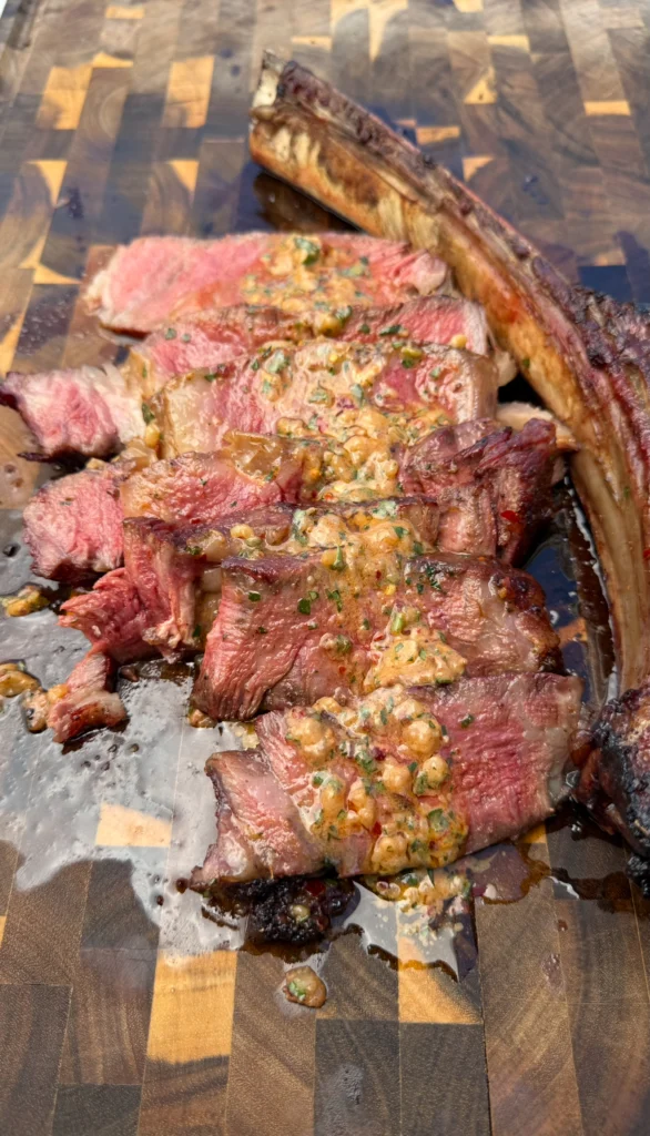 sliced tomahawk steak with cowboy butter