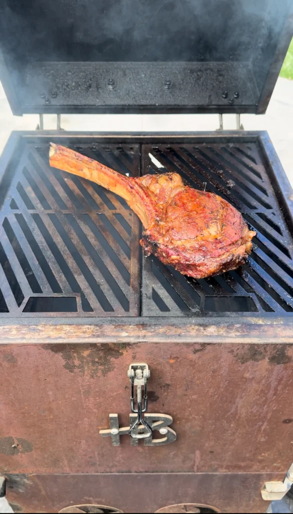 grilling the tomahawk steak on the hasty bake 