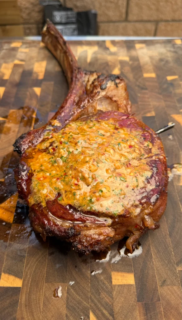 cowboy butter on the smoked tomahawk steak