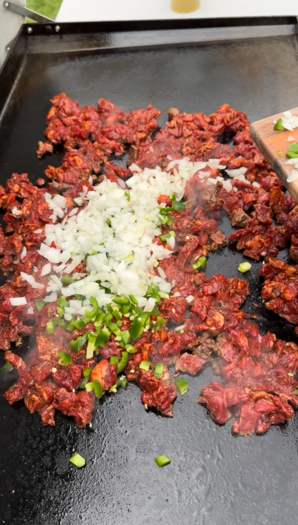 cooked carne asada on a loco griddle