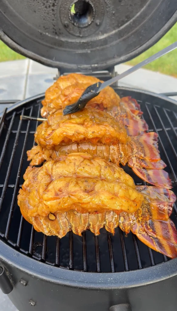 lobster being glazed with the sauce