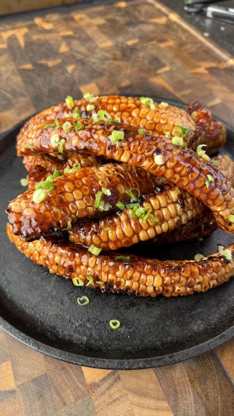 finished corn ribs on a black plate