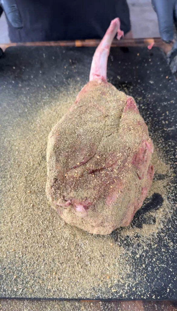 seasoned ribeye on the cutting board