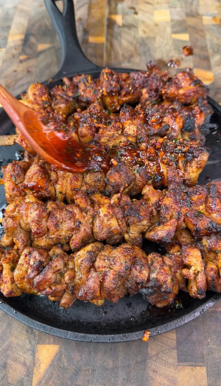 easy chicken skewers on a black plate