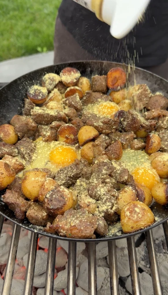 cast iron steak and potatoes in a skillet