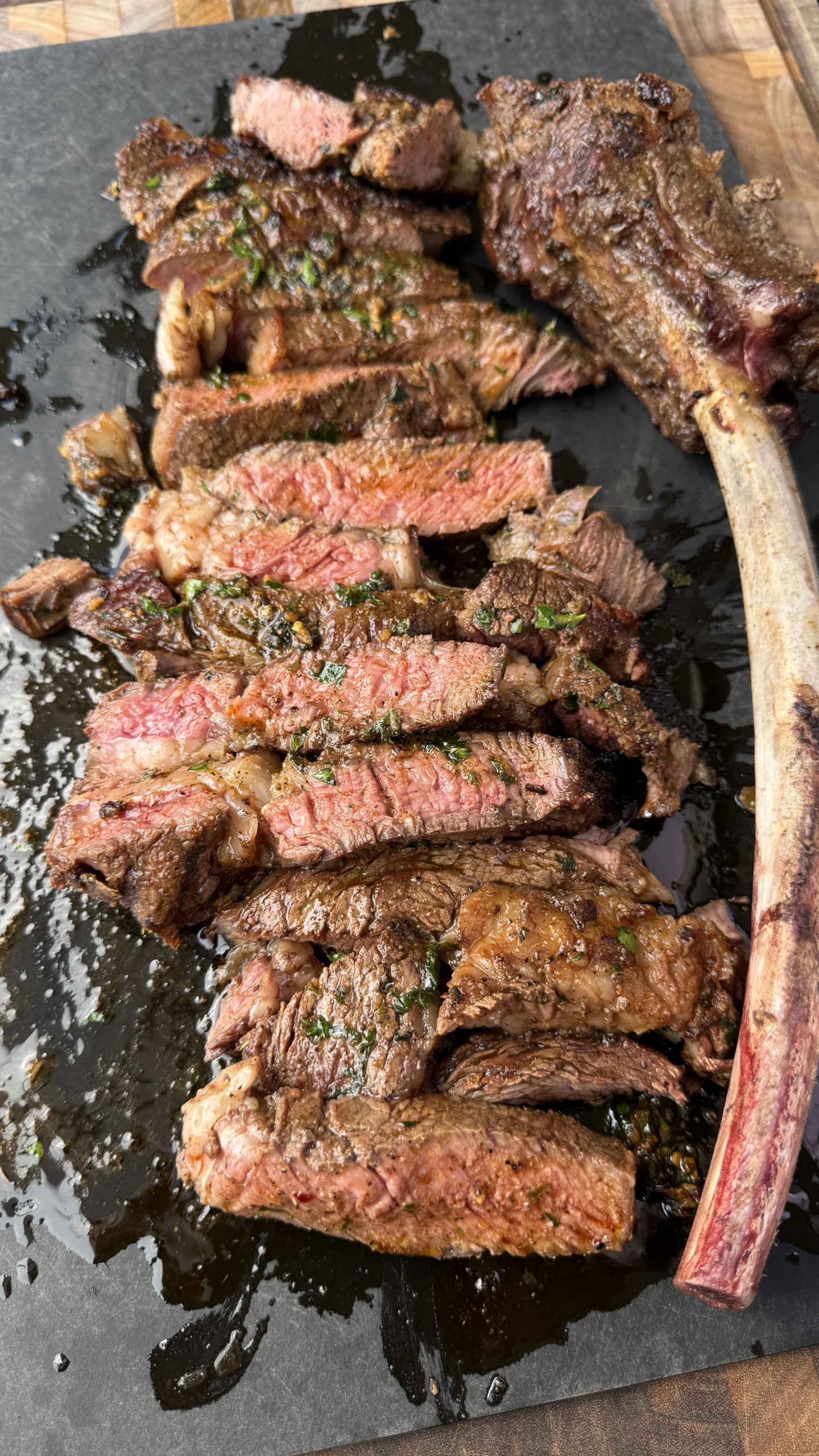 sliced ribeye on a cutting board