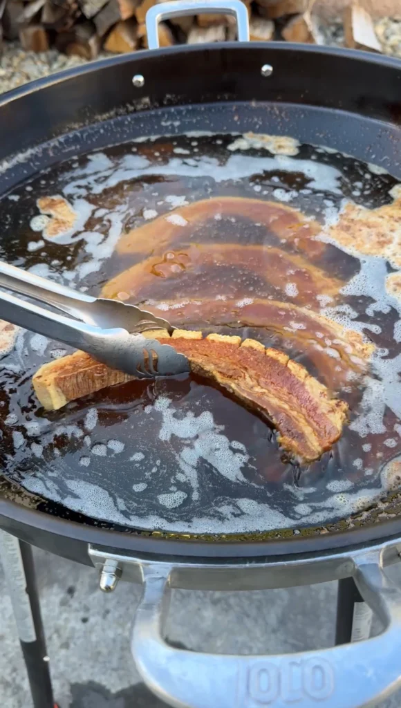 double fried chicharrónes in a cast iron