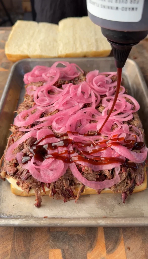 pulled beef sliders with red onions and bbq sauce