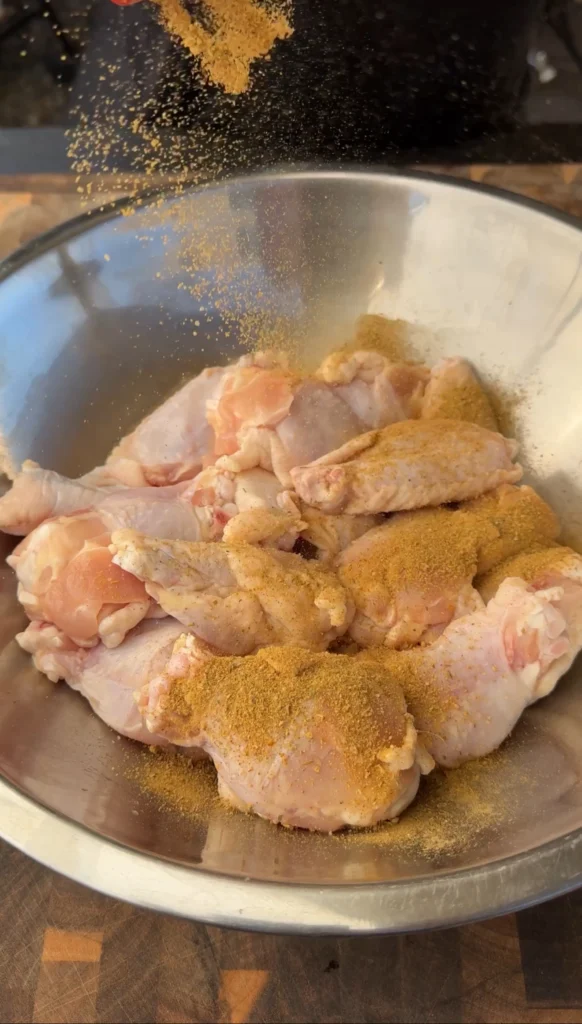 seasoned raw wings in a bowl