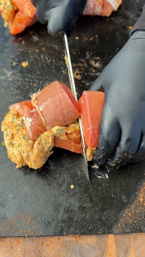rolling the salmon pinwheels and cutting them