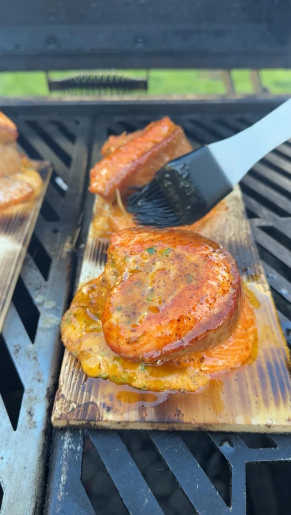 salmon pinwheels being glazed