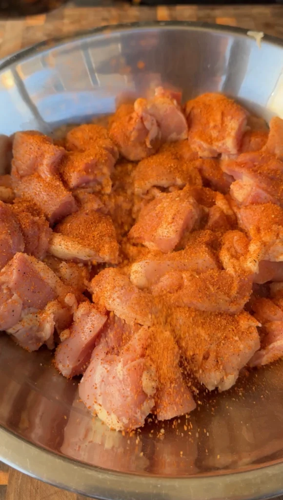 seasoned chicken thighs on skewers