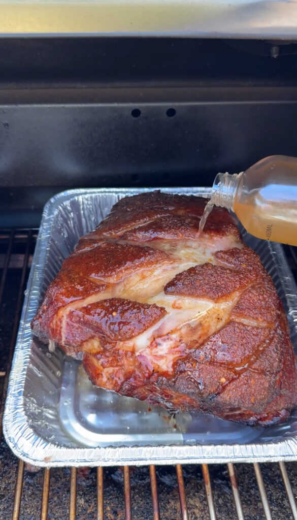 cooking the pork shoulder in a foil boat
