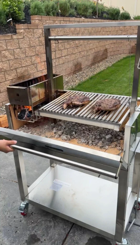 cooking the two steaks over charcoal