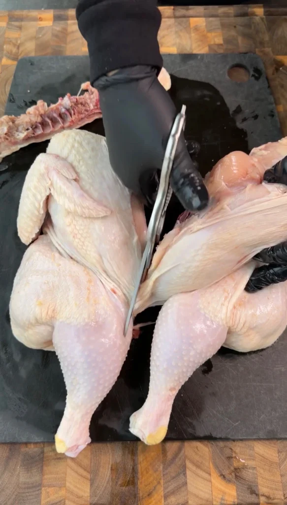 spatchcocked chicken on a cutting board