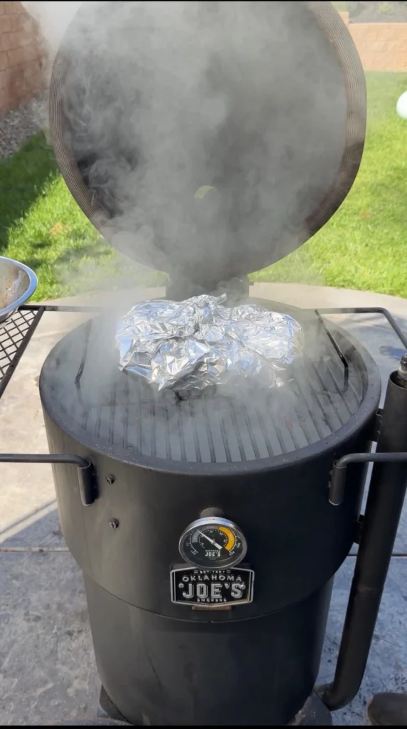 wrapped pork nelly burnt ends in the smoker