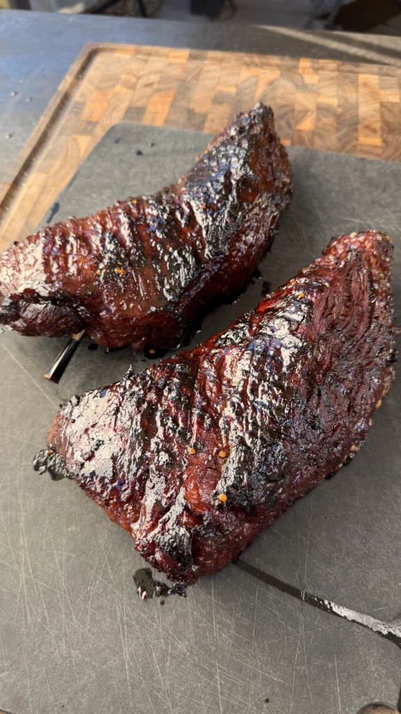 tri tip with a meat probe on a cutting board