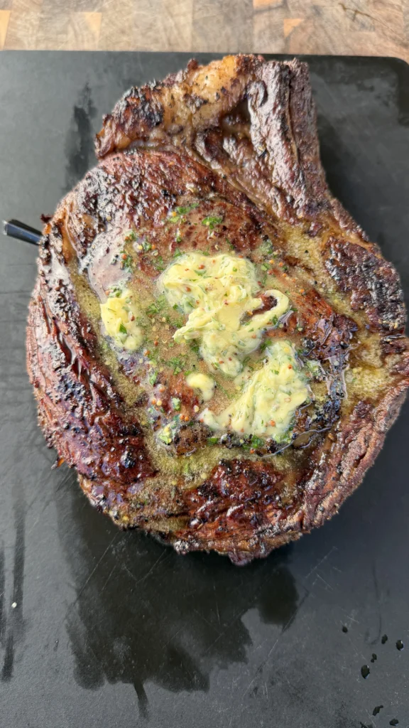 resting the ribeye steak on a cutting board
