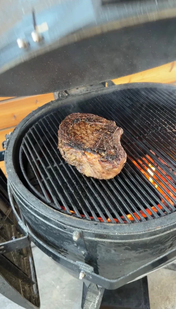 seared cowboy steak over indirect heat