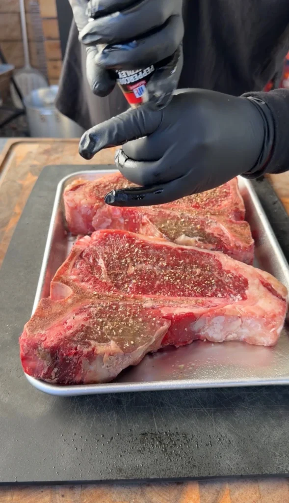 seasoned porterhouse on a silver tray