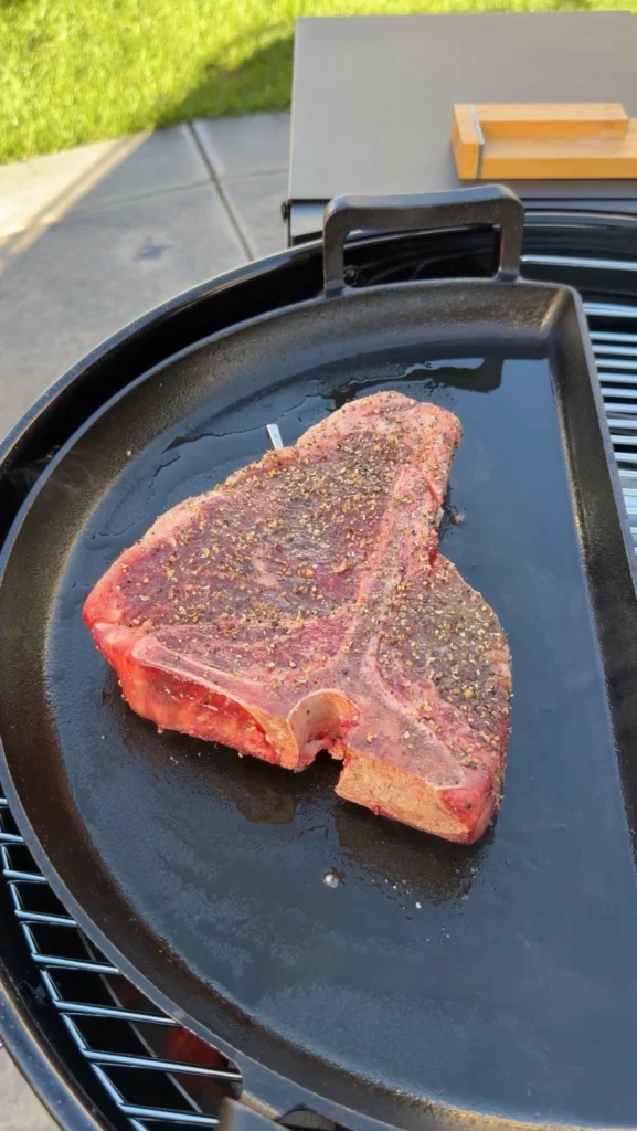 searing the steak over direct heat