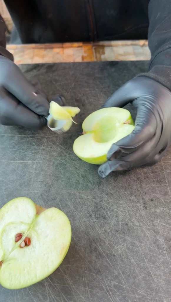 cored apples on a cutting board