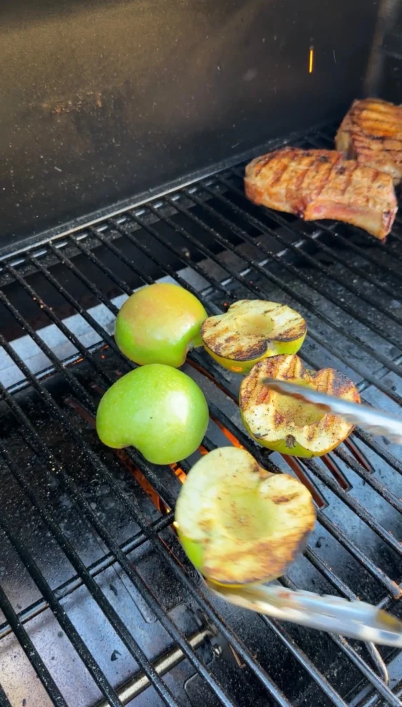grilling apples over a gas grill
